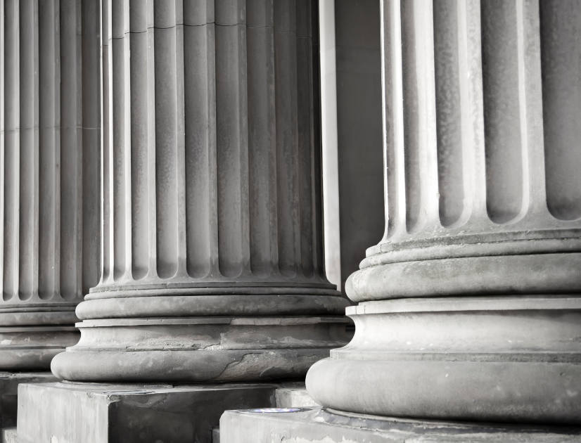 The foreboding stone columns of a legal building